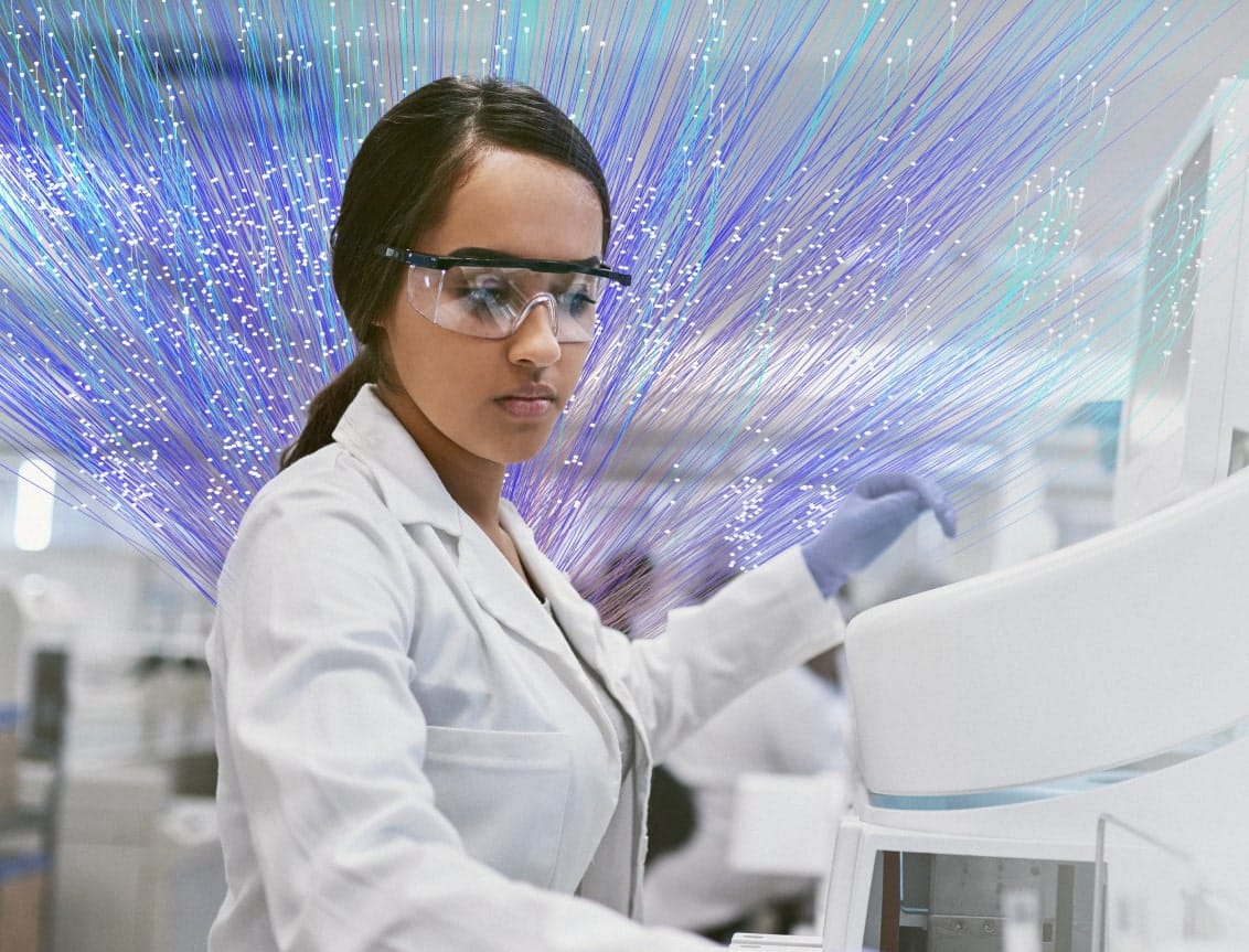 female scientist wearing safety glasses